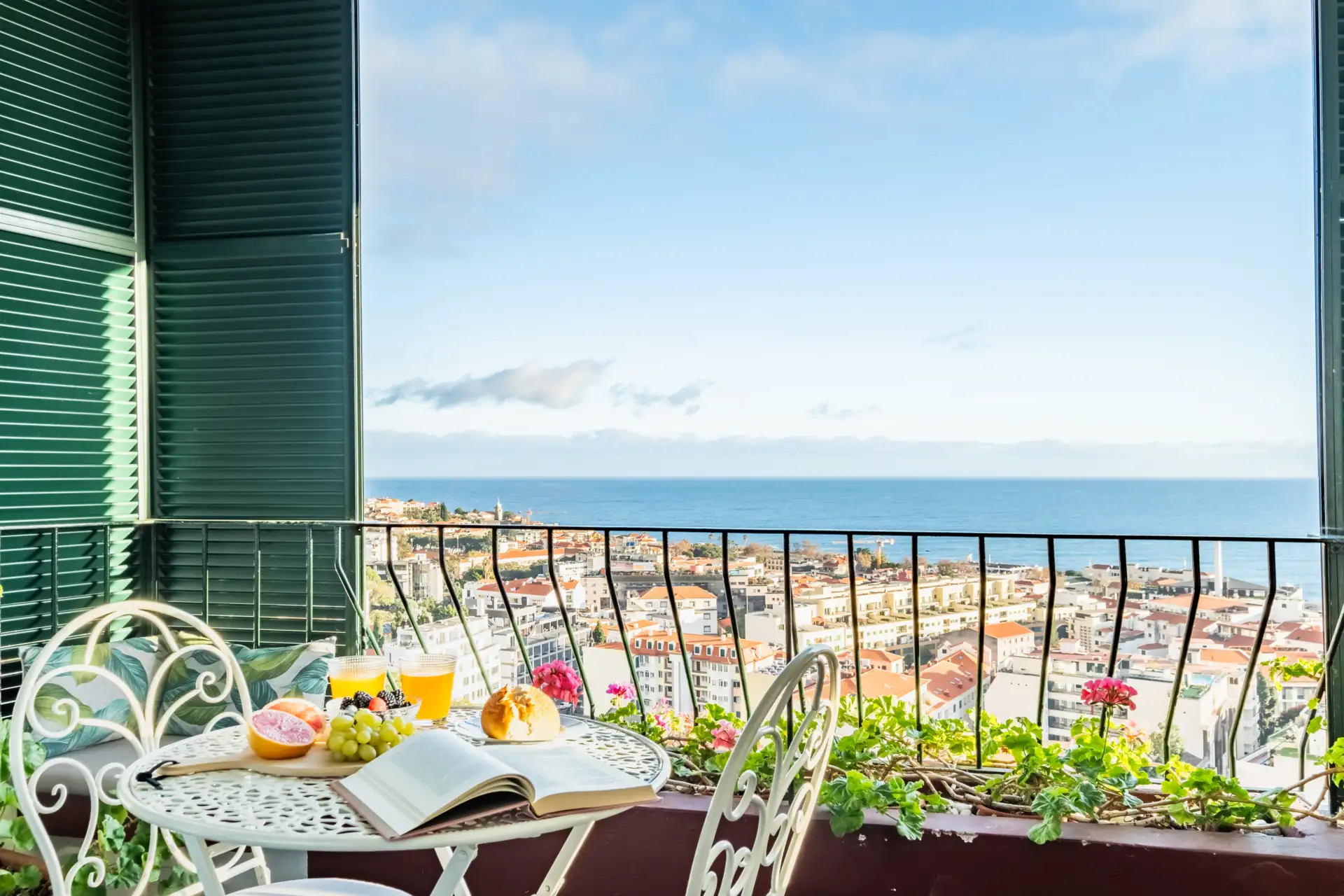 Breakfast on a Querido Recanto balcony overlooking Funchal and the Atlantic